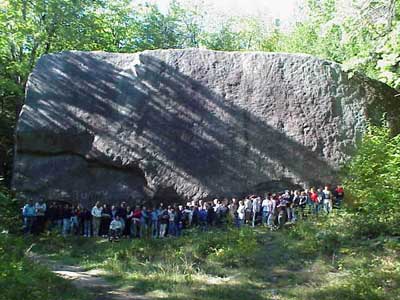 Super Large Boulder with 100 people in lower foregound